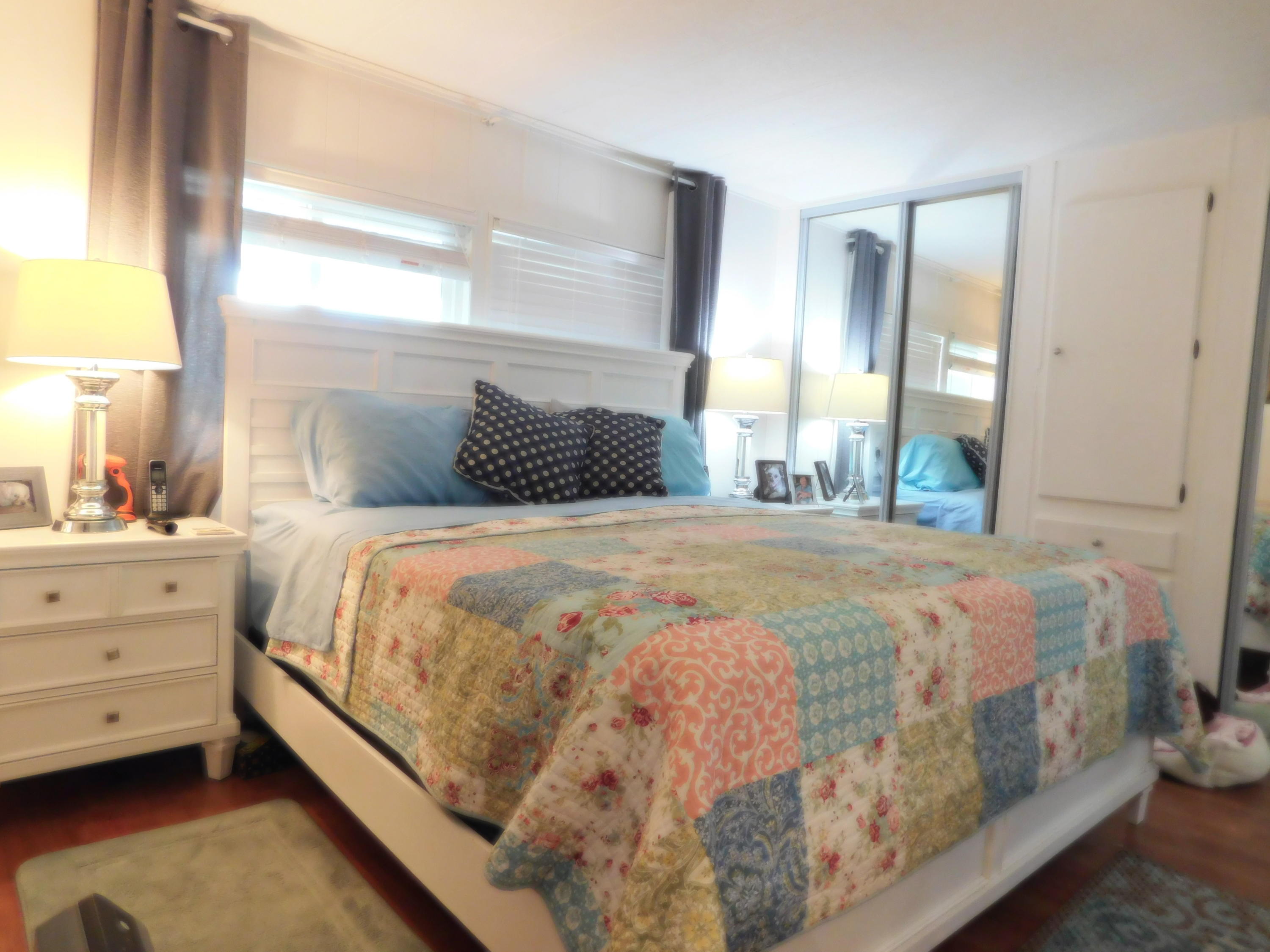 51555 Monroe Street, Unit 52 Indio, CA 92201 - Photo 16 of 42 a bedroom with a bed and a window