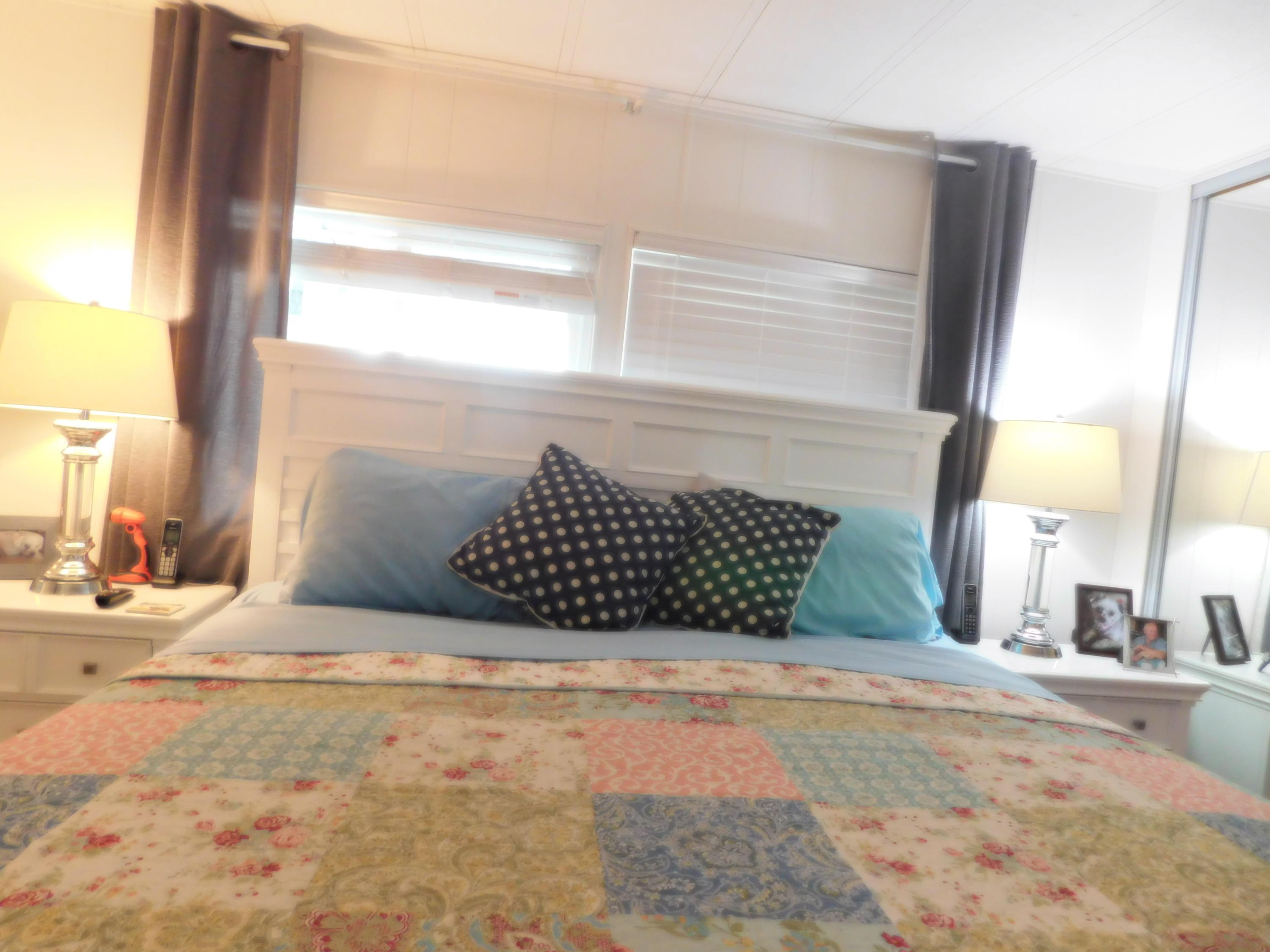 51555 Monroe Street, Unit 52 Indio, CA 92201 - Photo 17 of 42 a large bed sitting in a bedroom next to a window