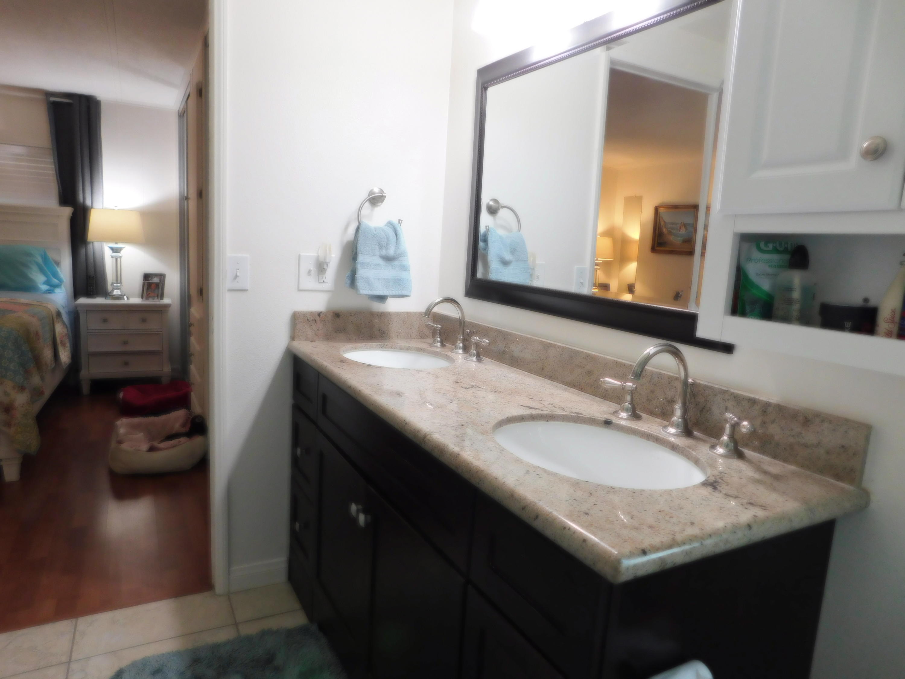 51555 Monroe Street, Unit 52 Indio, CA 92201 - Photo 18 of 42 a bathroom with a sink and a mirror