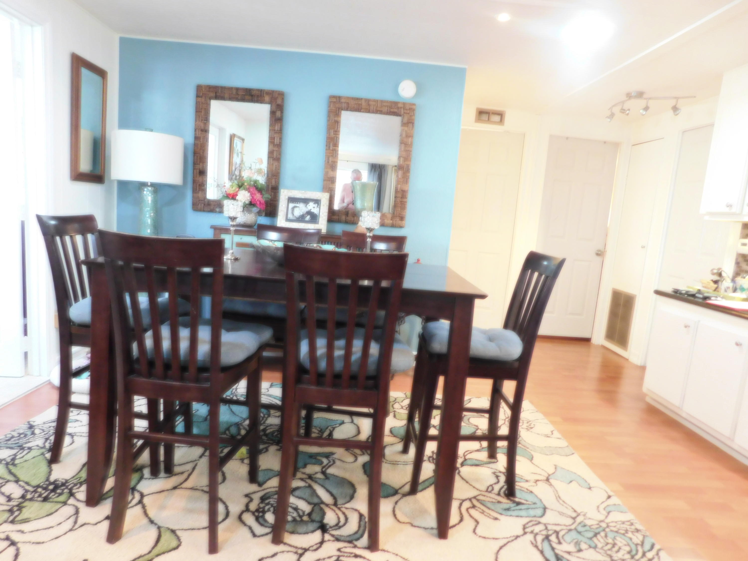 51555 Monroe Street, Unit 52 Indio, CA 92201 - Photo 3 of 42 a view of a dining room and livingroom with furniture