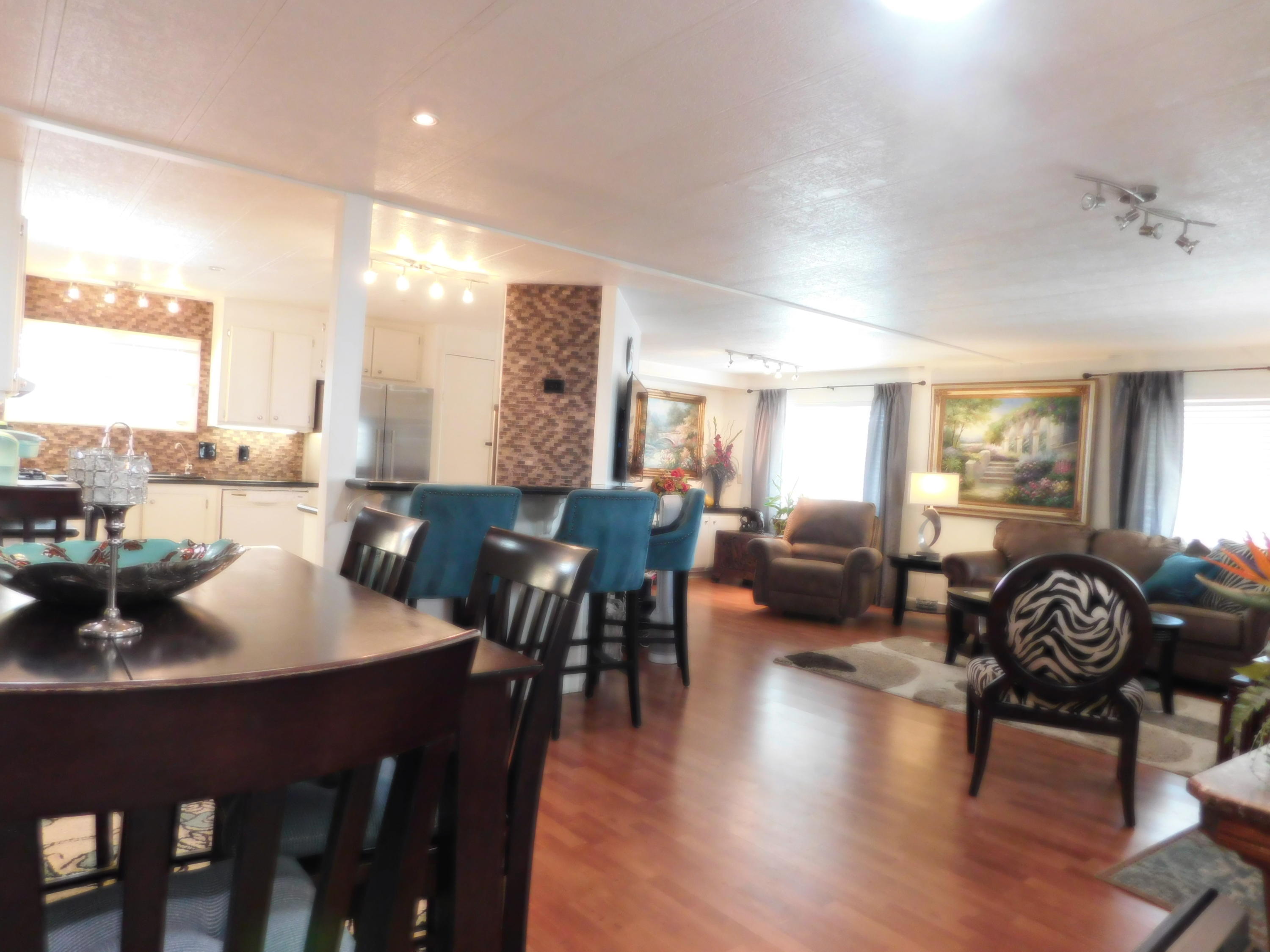 51555 Monroe Street, Unit 52 Indio, CA 92201 - Photo 24 of 42 a view of a a dining room with furniture and wooden floor