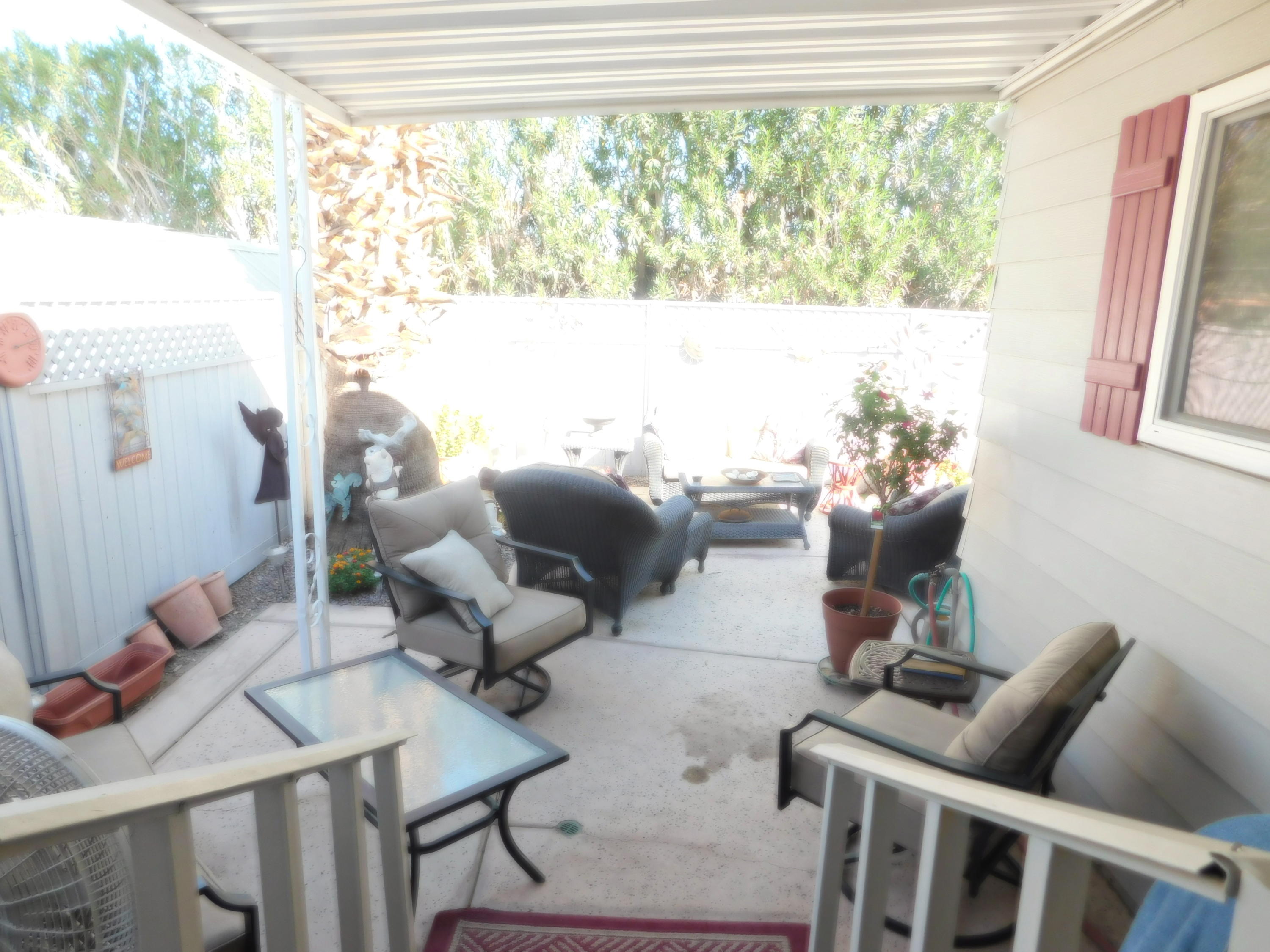 51555 Monroe Street, Unit 52 Indio, CA 92201 - Photo 28 of 42 a living room with furniture and a large window