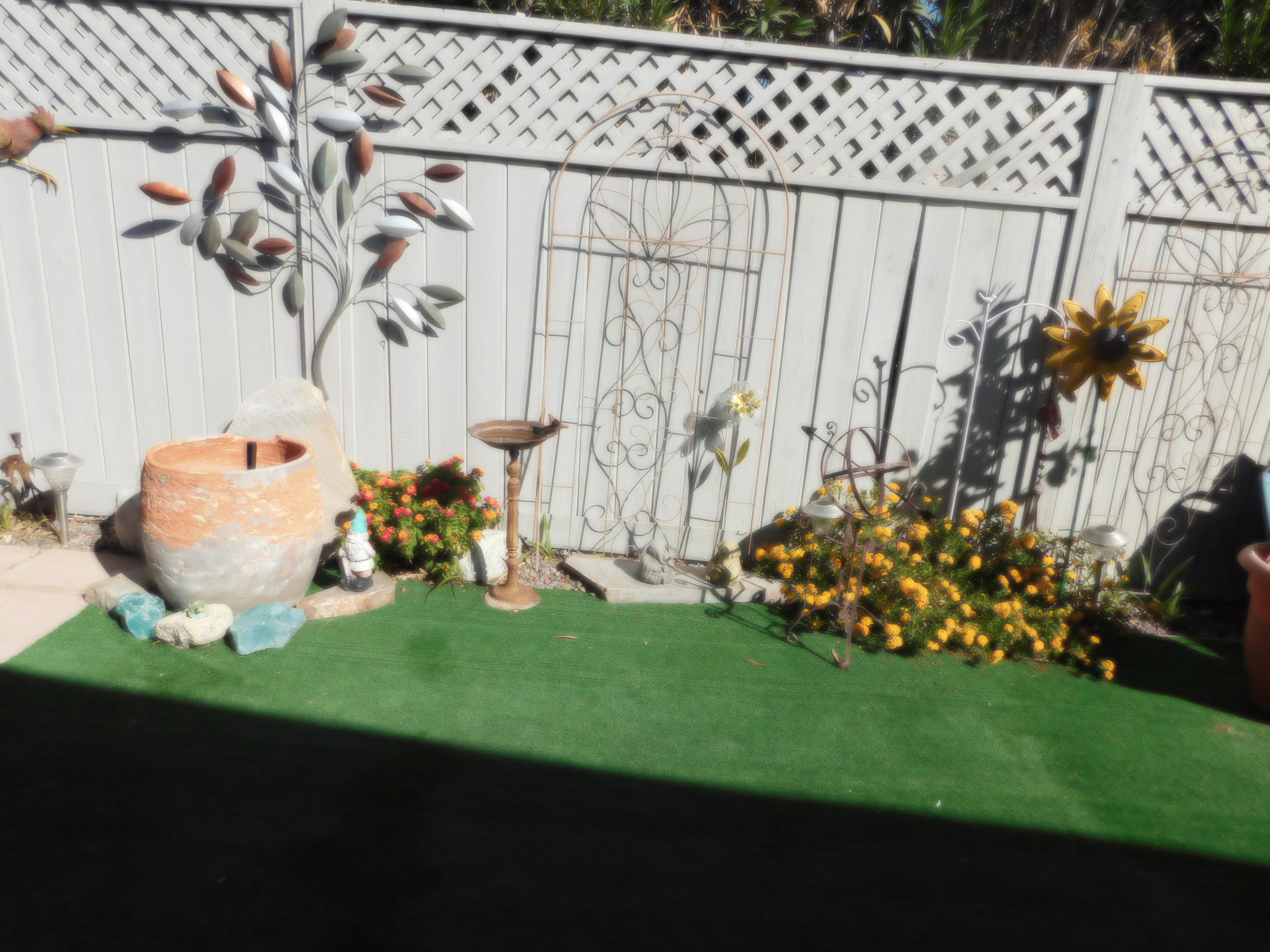 51555 Monroe Street, Unit 52 Indio, CA 92201 - Photo 29 of 42 a view of a table and chair in the garden