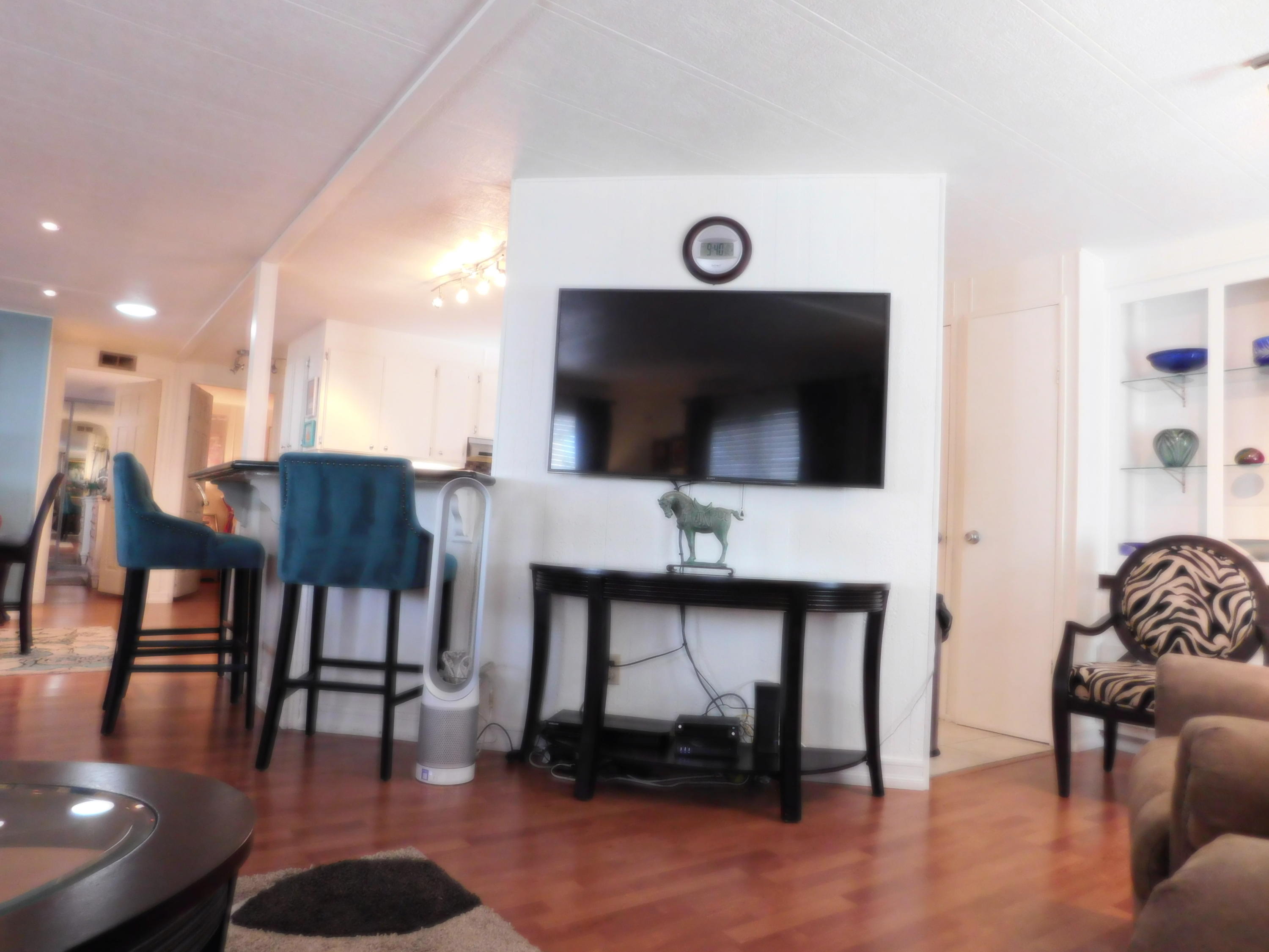 51555 Monroe Street, Unit 52 Indio, CA 92201 - Photo 4 of 42 a view of a livingroom with furniture and a flat screen tv