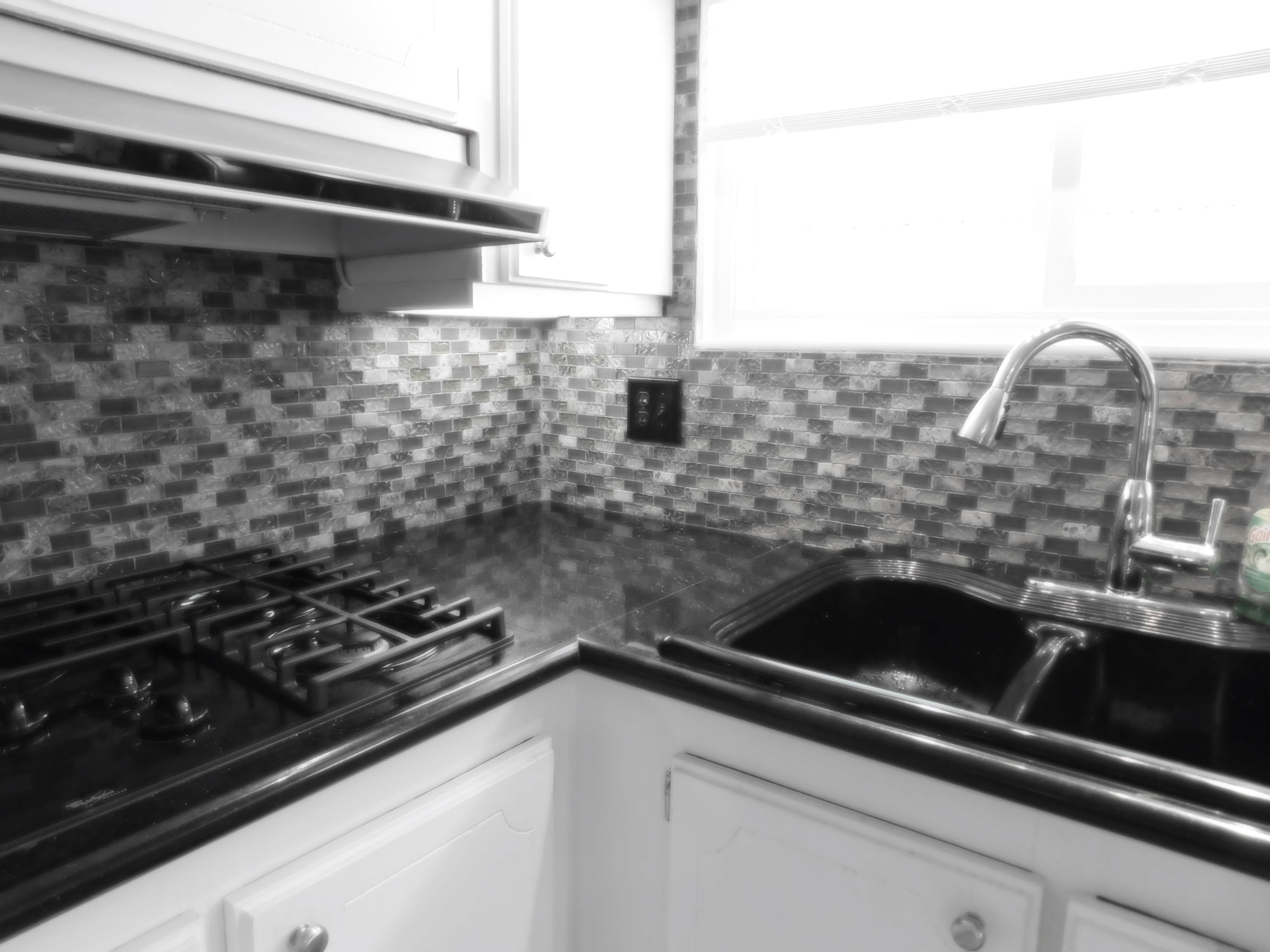 51555 Monroe Street, Unit 52 Indio, CA 92201 - Photo 41 of 42 a close view of sink a stove and tap