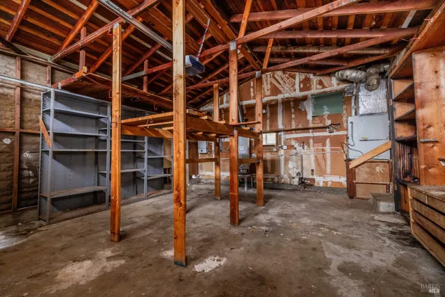 a view of an empty room with wooden walls