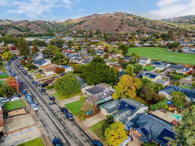 an aerial view of residential houses with outdoor space