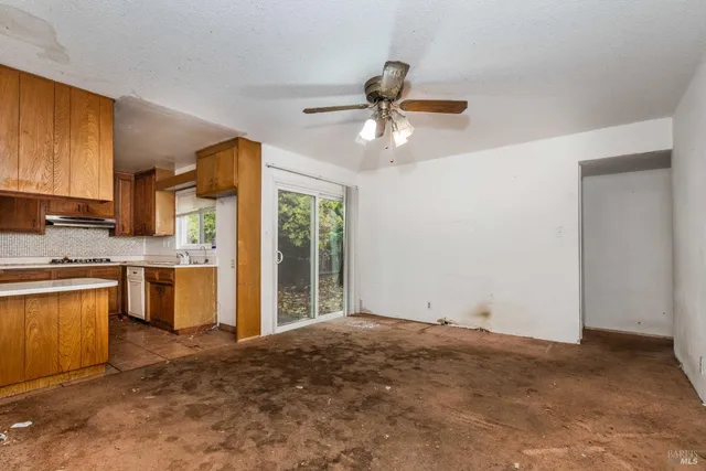 a view of a kitchen with a sink and a window