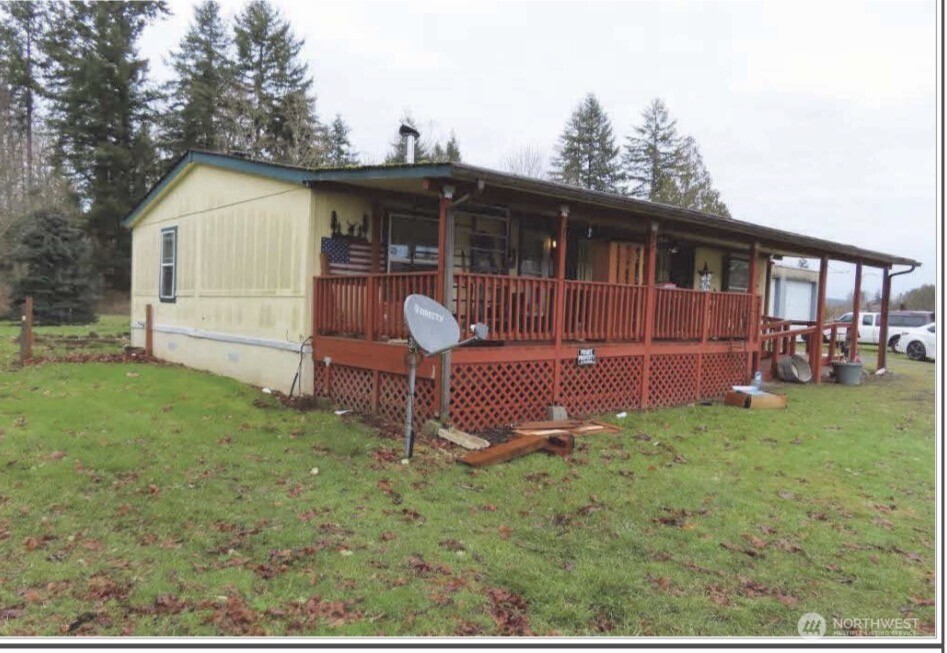693 Gish Road Onalaska, WA 98570 - Photo 1 of 1 a front view of a house with a garden