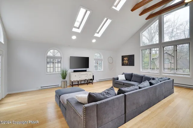 a living room with furniture and a flat screen tv