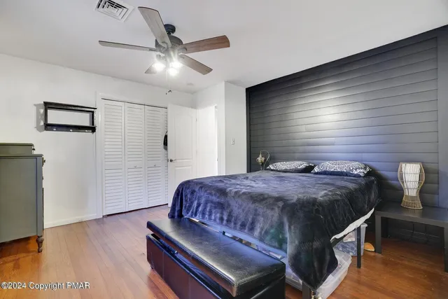 a bedroom with a bed and a table