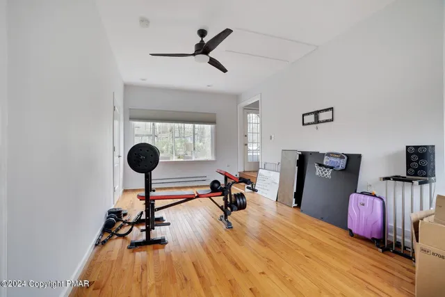 a bedroom with furniture and a chandelier