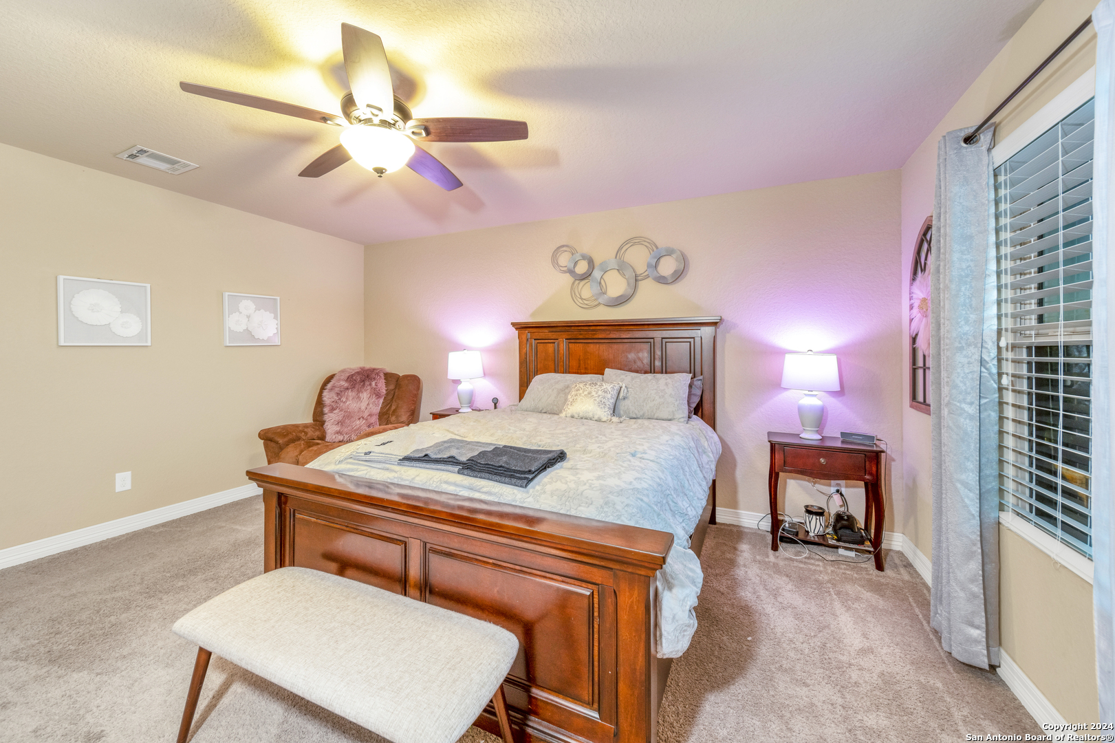 511 Fort Apache San Antonio, TX 78245 - Photo 18 of 32 a bedroom with a bed and a chandelier