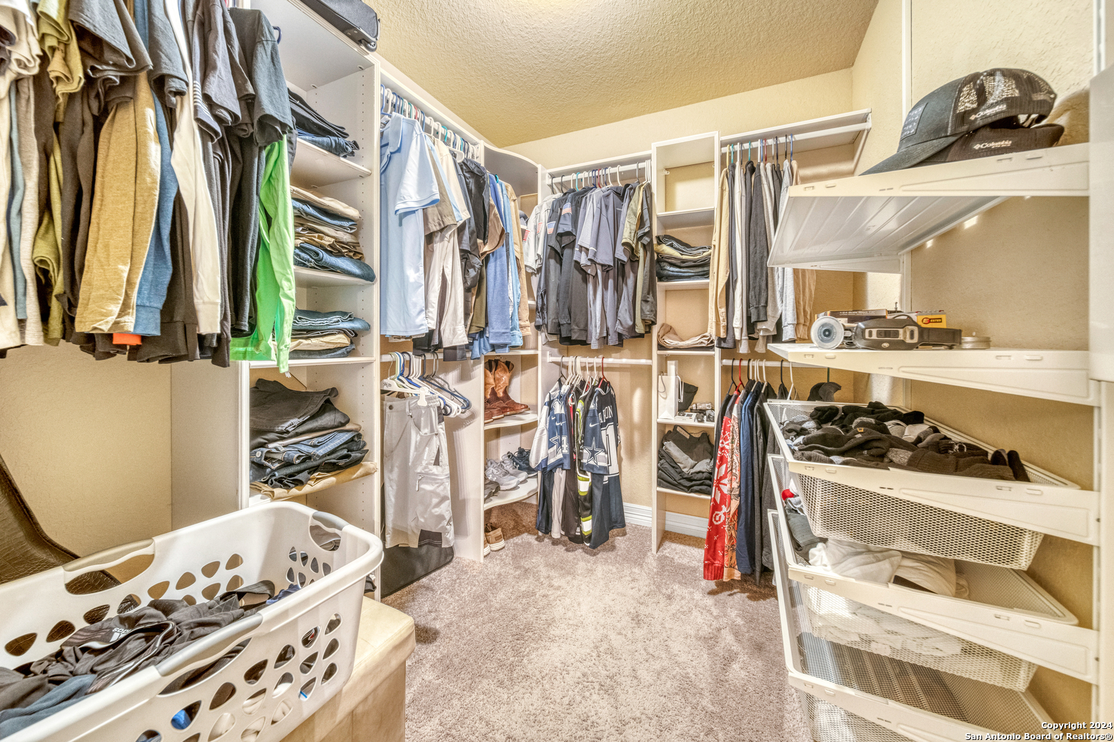511 Fort Apache San Antonio, TX 78245 - Photo 19 of 32 a view of walk in closet with clothes and shoes