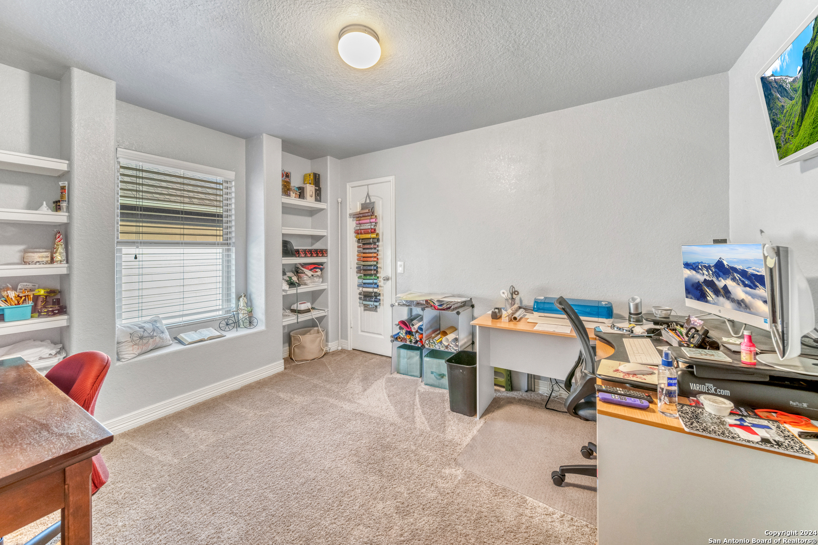 511 Fort Apache San Antonio, TX 78245 - Photo 25 of 32 a view of a workspace with furniture and a window