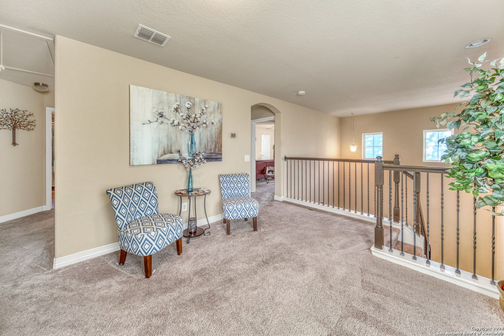 511 Fort Apache San Antonio, TX 78245 - Photo 26 of 32 a view of a hallway with paintings on the wall