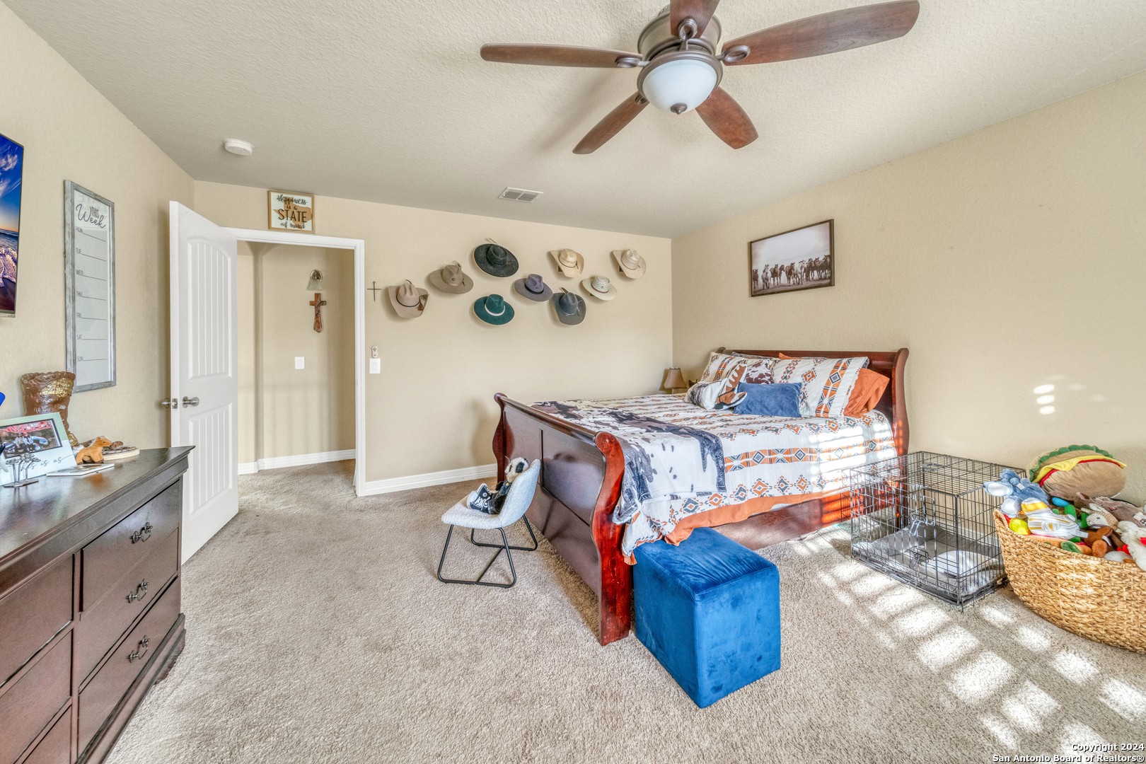 511 Fort Apache San Antonio, TX 78245 - Photo 28 of 32 a bedroom with a bed and wooden floor
