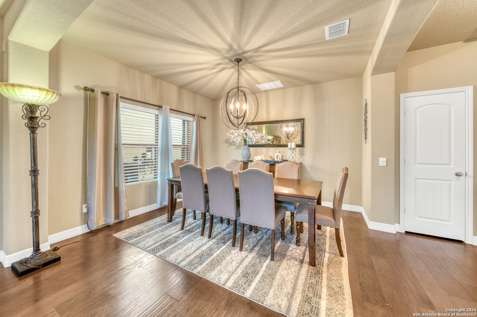 511 Fort Apache San Antonio, TX 78245 - Photo 6 of 32 a view of a dining room with furniture window and wooden floor