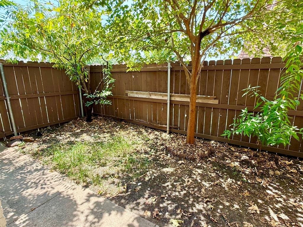 3650 Rickshaw Drive, Unit 3656 Dallas, TX 75229 - Photo 20 of 20 Spare room featuring a ceiling fan and dark wood-style flooring