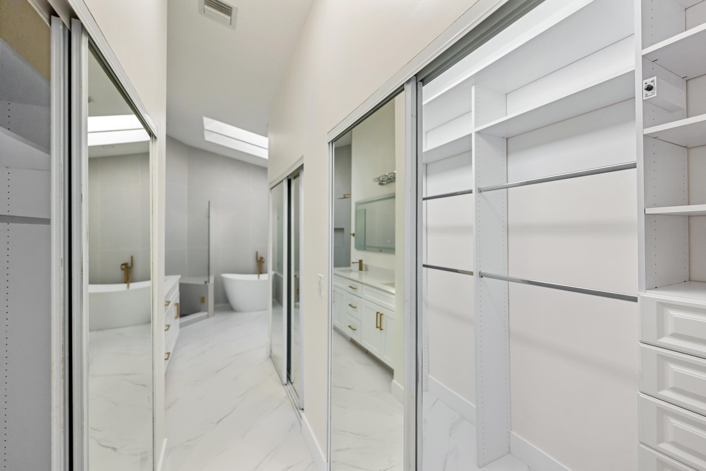 17277 Hampton Boulevard Boca Raton, FL 33496 - Photo 19 of 55 a bathroom with a tub and shower