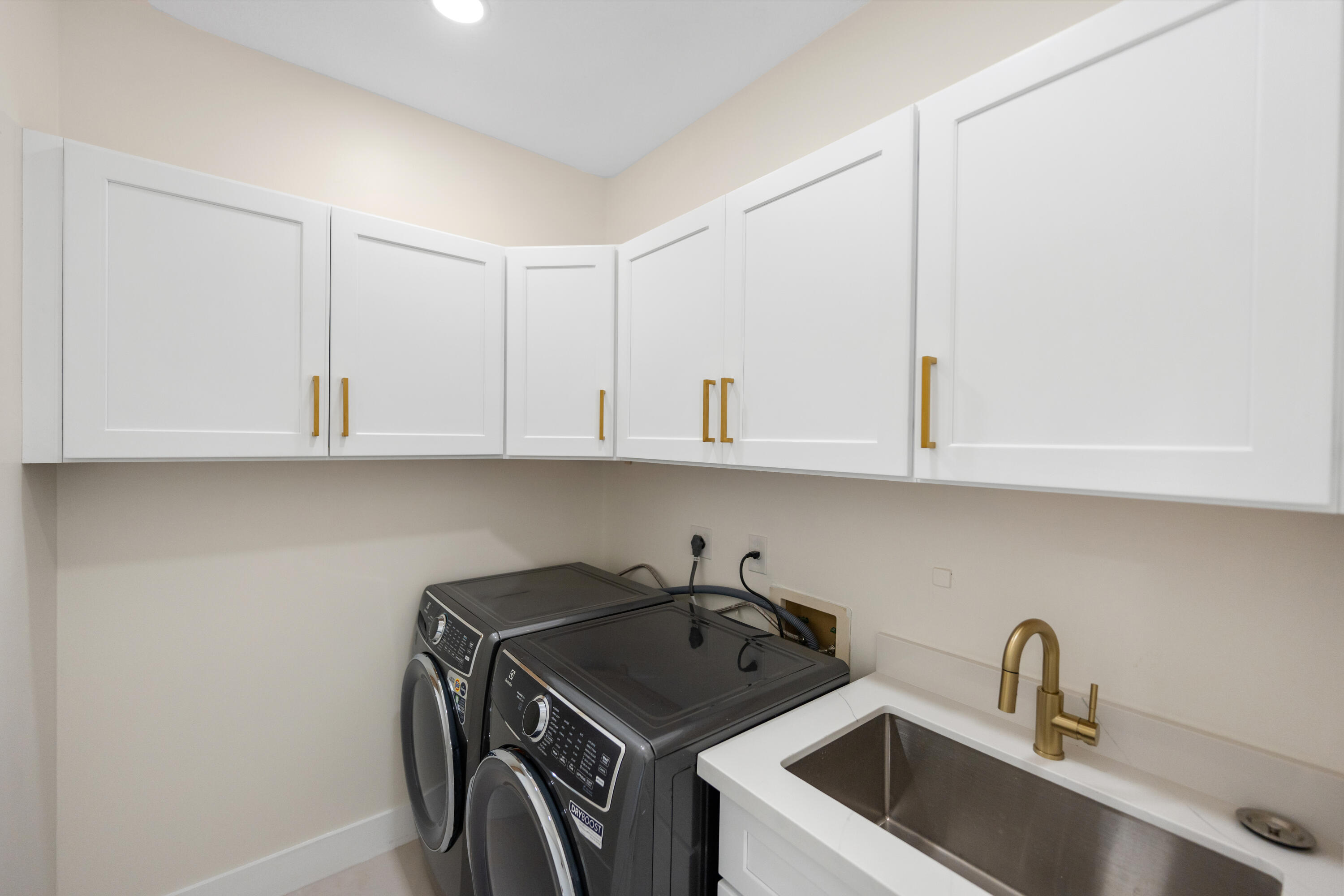 17277 Hampton Boulevard Boca Raton, FL 33496 - Photo 25 of 55 a kitchen with a sink and cabinets
