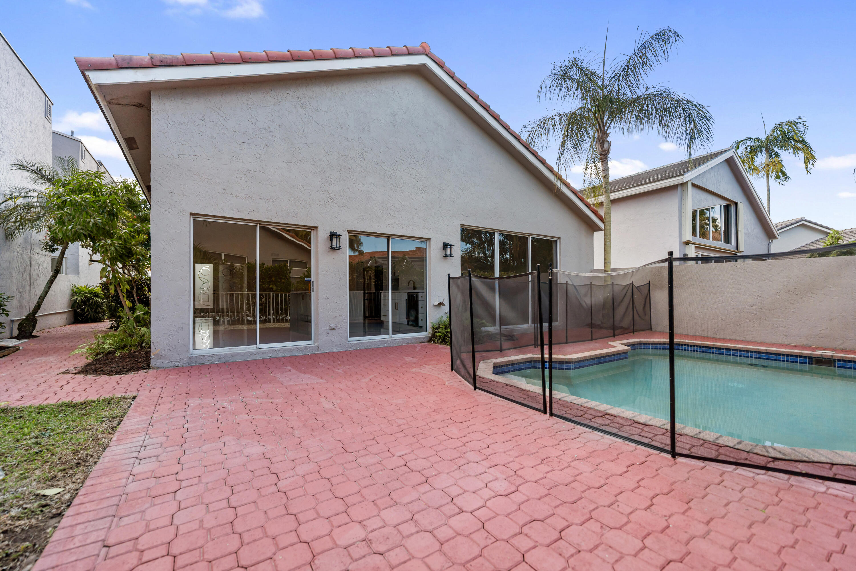 17277 Hampton Boulevard Boca Raton, FL 33496 - Photo 28 of 55 a view of a house with a backyard