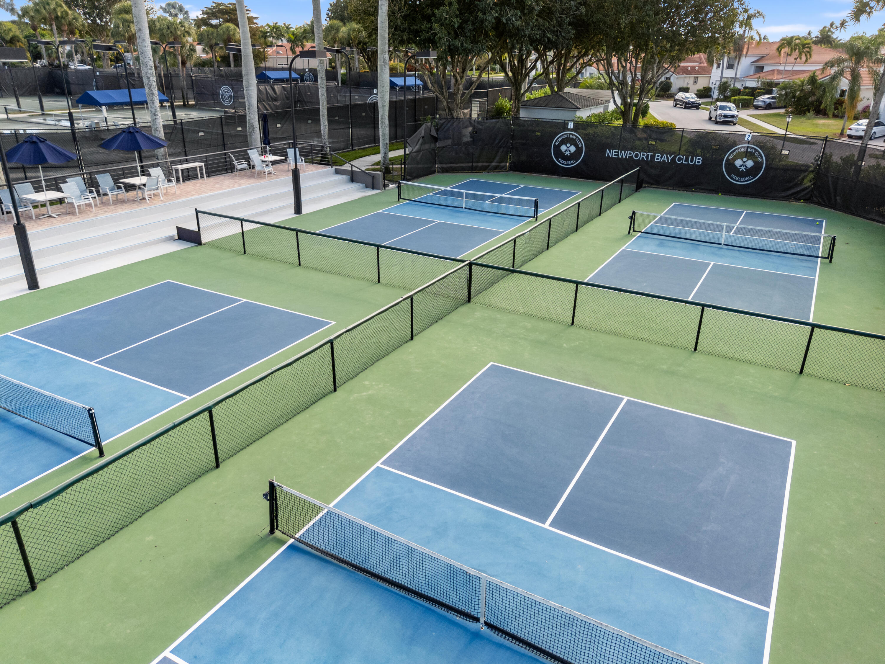 17277 Hampton Boulevard Boca Raton, FL 33496 - Photo 45 of 55 a view of a tennis ground with large trees