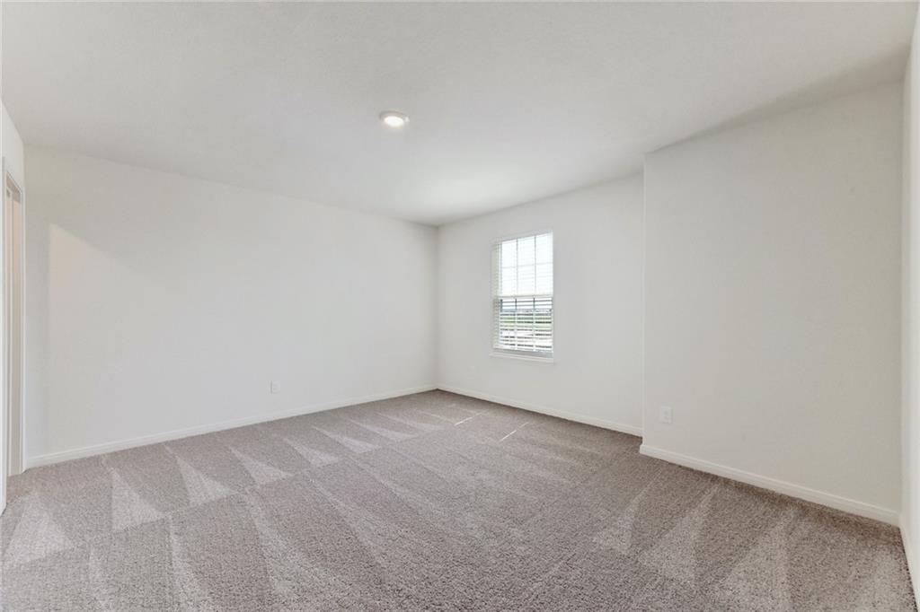 105 Brunswick Lane Jarrell, TX 76537 - Photo 17 of 18 a view of an empty room with a window