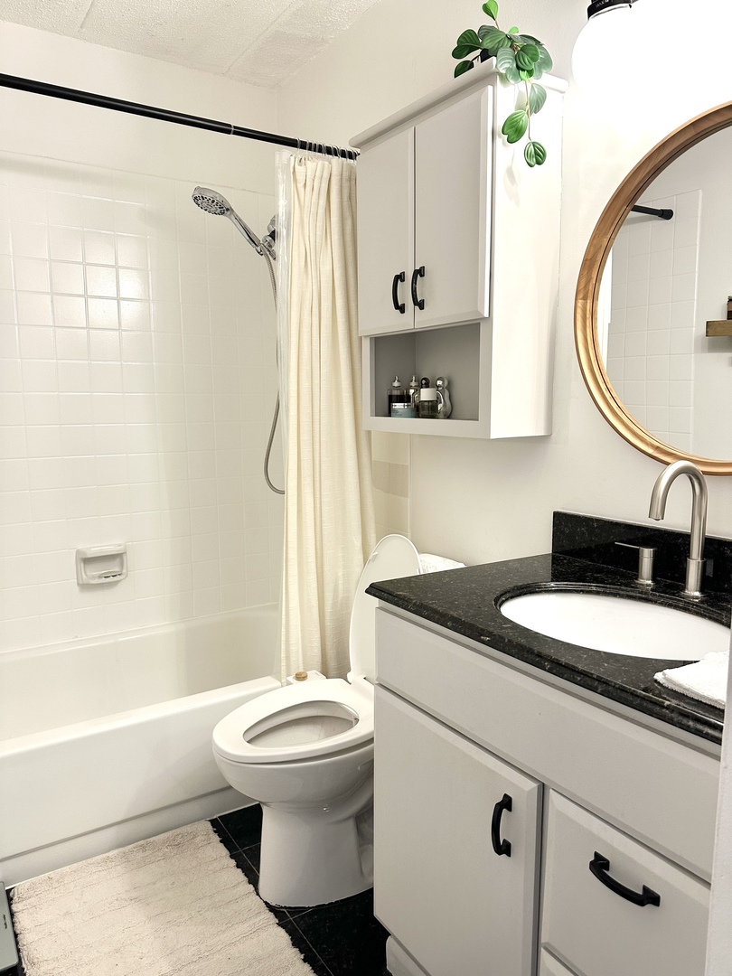 75 Kristin Circle, Unit 126 Schaumburg, IL 60195 - Photo 13 of 15 a bathroom with a granite countertop sink toilet and shower