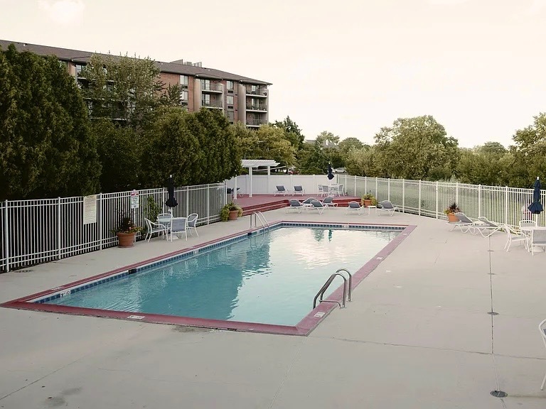 75 Kristin Circle, Unit 126 Schaumburg, IL 60195 - Photo 15 of 15 a view of a swimming pool with a yard