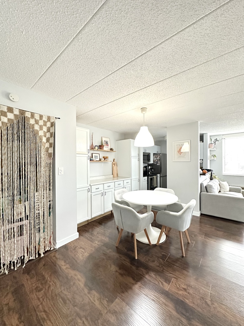 75 Kristin Circle, Unit 126 Schaumburg, IL 60195 - Photo 9 of 15 a view of a dining room with furniture window and wooden floor