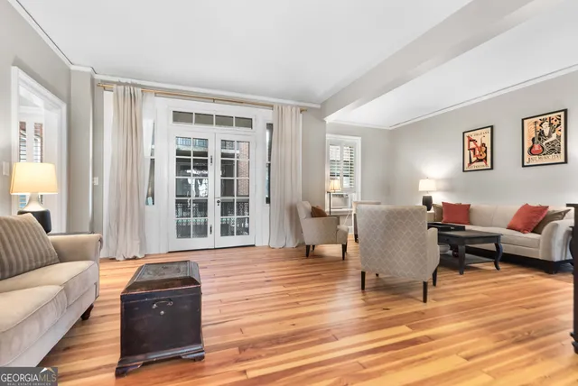 a living room with furniture and windows
