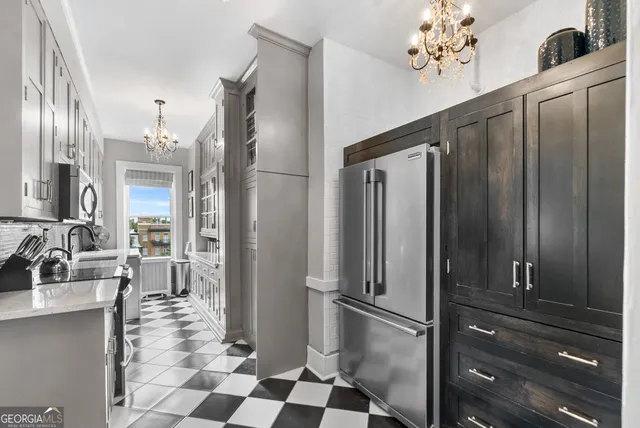 a view of a hallway to a livingroom with furniture