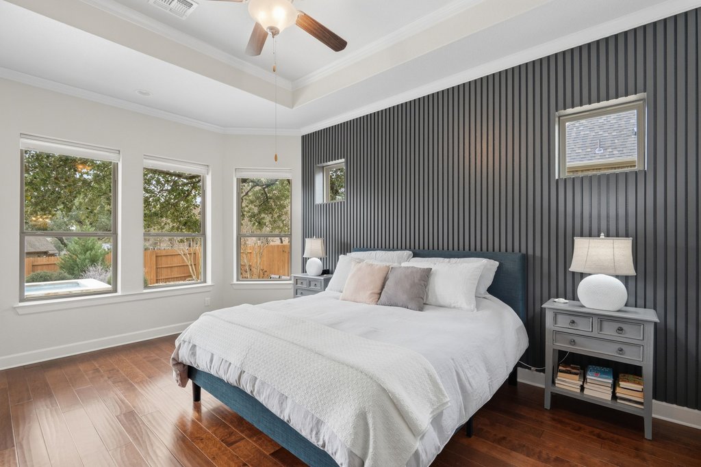 558 Merion Drive Austin, TX 78737 - Photo 20 of 40 a bedroom with a bed and a window