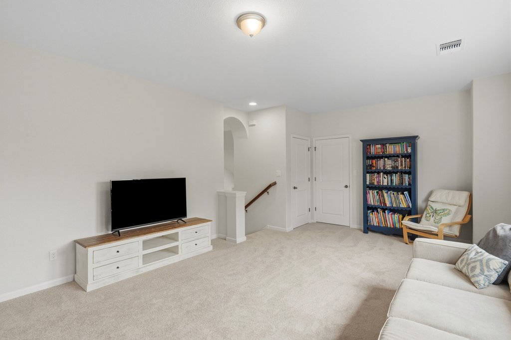 558 Merion Drive Austin, TX 78737 - Photo 26 of 40 a living room with furniture and a flat screen tv