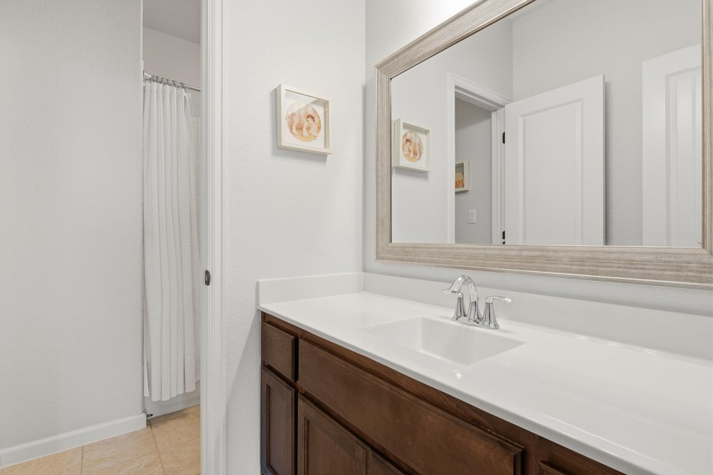558 Merion Drive Austin, TX 78737 - Photo 30 of 40 a bathroom with a sink and a mirror