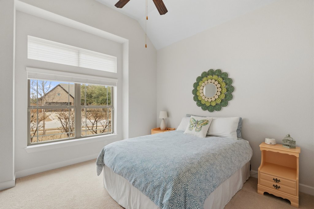 558 Merion Drive Austin, TX 78737 - Photo 4 of 40 a bedroom with a bed and a window