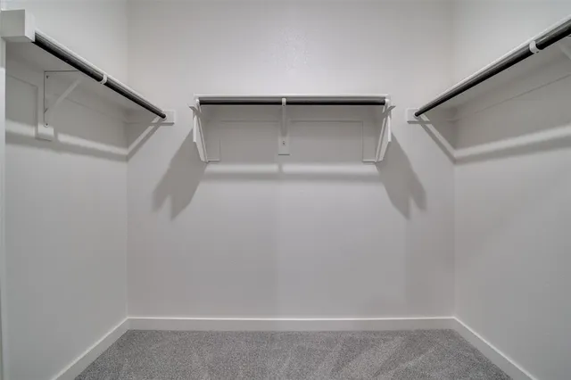 a view of an empty walk in closet