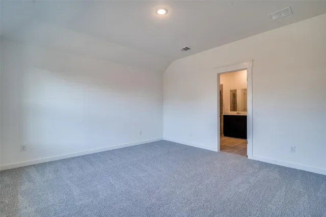 a view of an empty room and a window