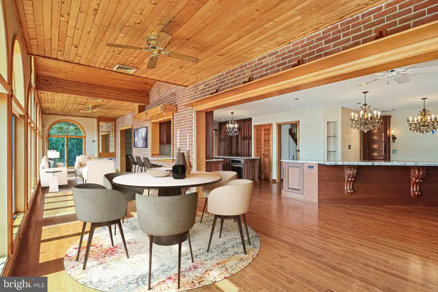 a large white kitchen with a large window