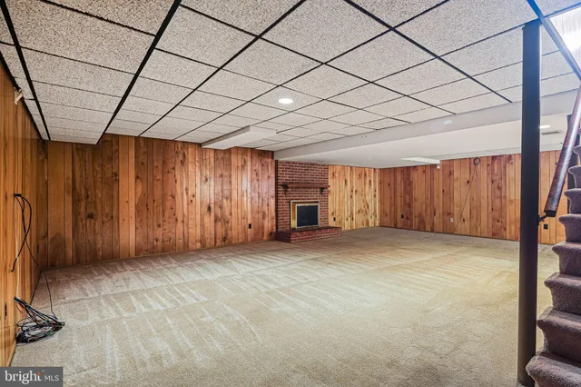 an aerial view of a house with swimming pool garden view and trees