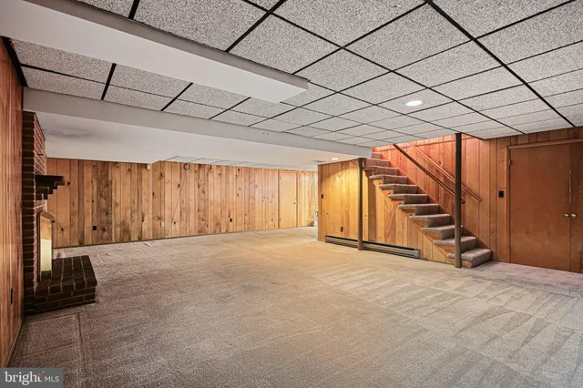 an aerial view of a house with swimming pool and outdoor space