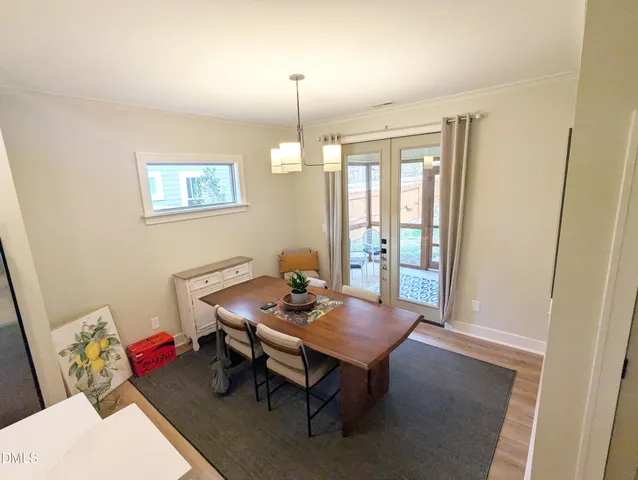 a reading room with furniture wooden floor and a window