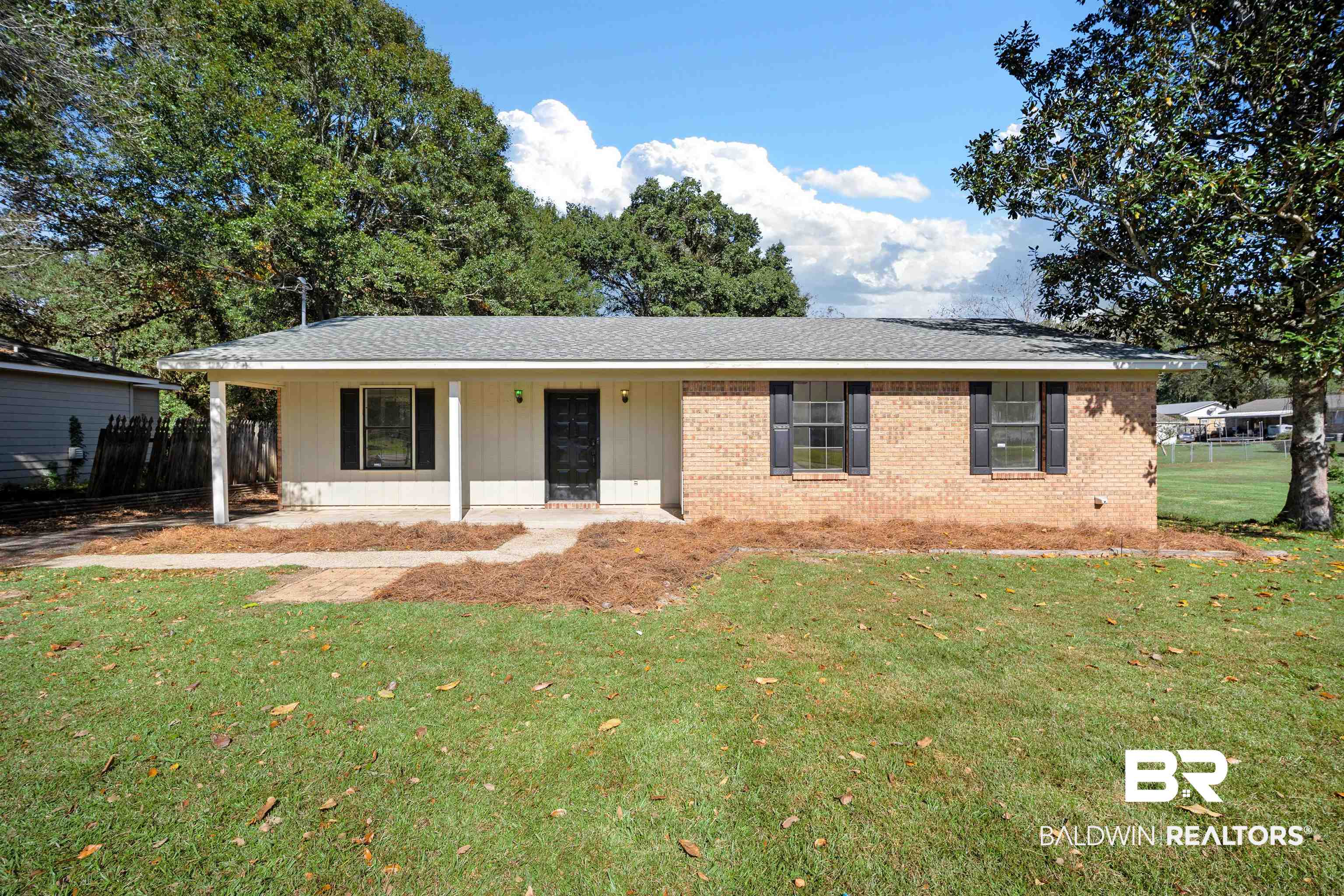 12910 Del Rio Street Grand Bay, AL 36541 - Photo 1 of 26 Ranch-style house featuring a porch, brick siding, and roof with shingles