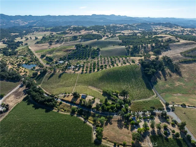 an aerial view of a houses with a lake view