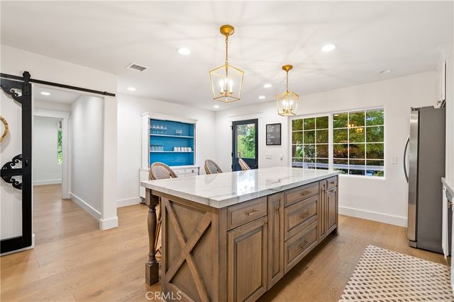 an aerial view of mountain with trees in the background