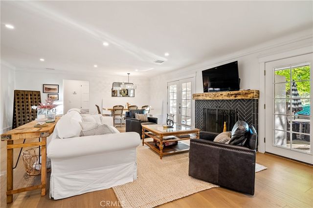 a view of a house with swimming pool and sitting area