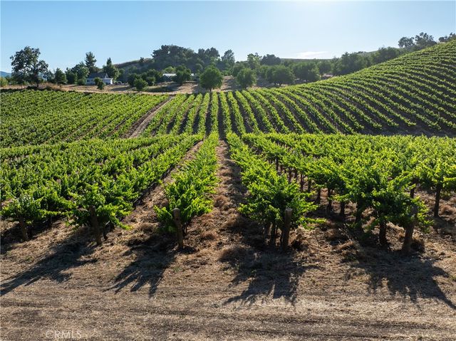 a living room with fireplace furniture and a wooden floor