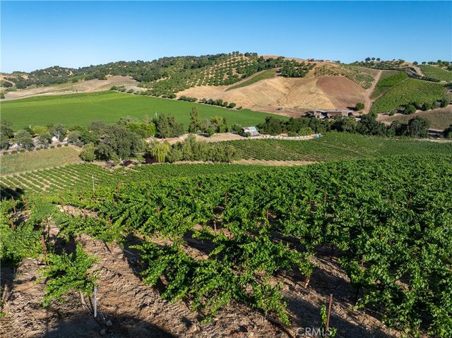 a bathroom with a granite countertop sink a toilet and a shower