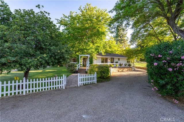 a view of a house with a fence